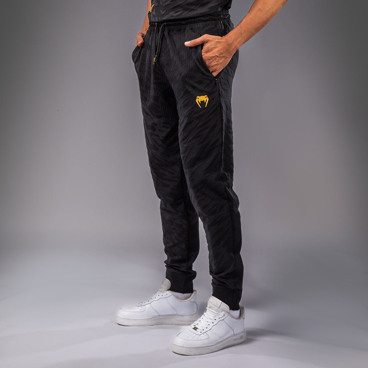 UFC Fusion by Venum Pánské kalhoty Authentic Fight Night Walkout - Champion